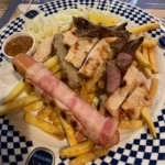 Löwengrube Ancona — piatto tipico con carne e patate